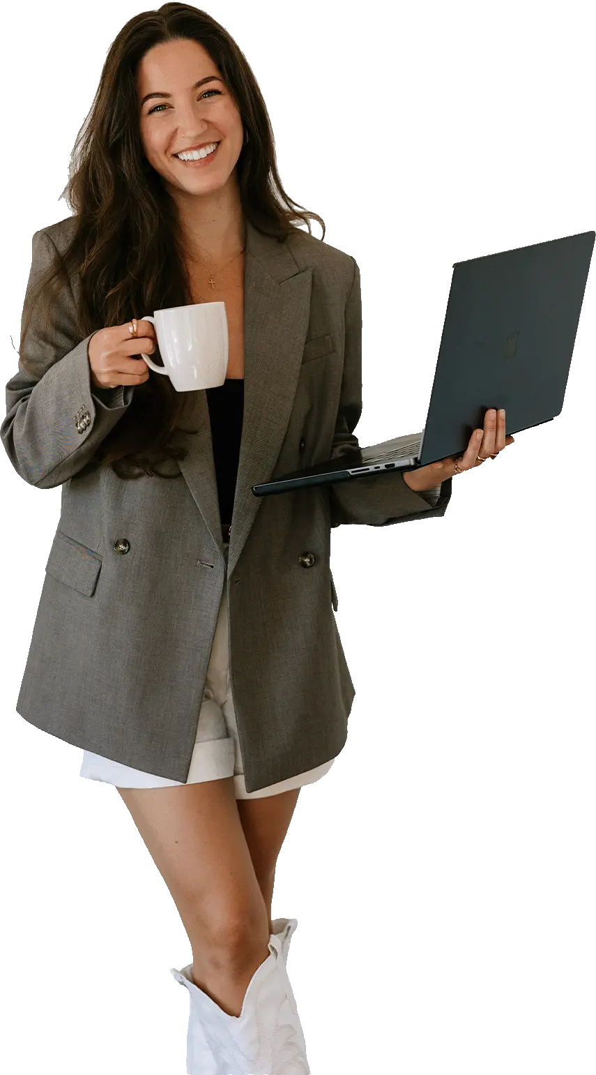Woman holding a coffee and laptop